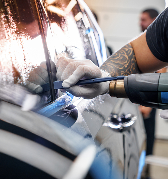 MINT mobile detailing team working on a vehicle in Calgary